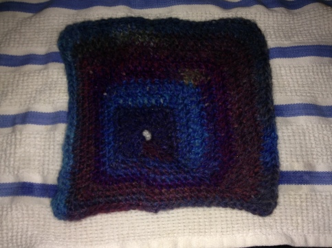 So, this is the one I ended up not liking. I like the idea behind it, that you have an off-center square, but I didn't like just how not square it ended up. You really would need to block every square individually to be sure you were sewing them together right. No thank you.